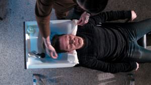 An overhead shot of someone getting their hair washed