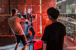 People filming an action star